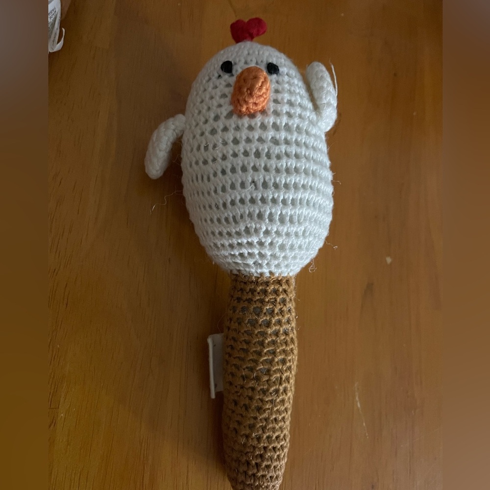 White hen rattle stick